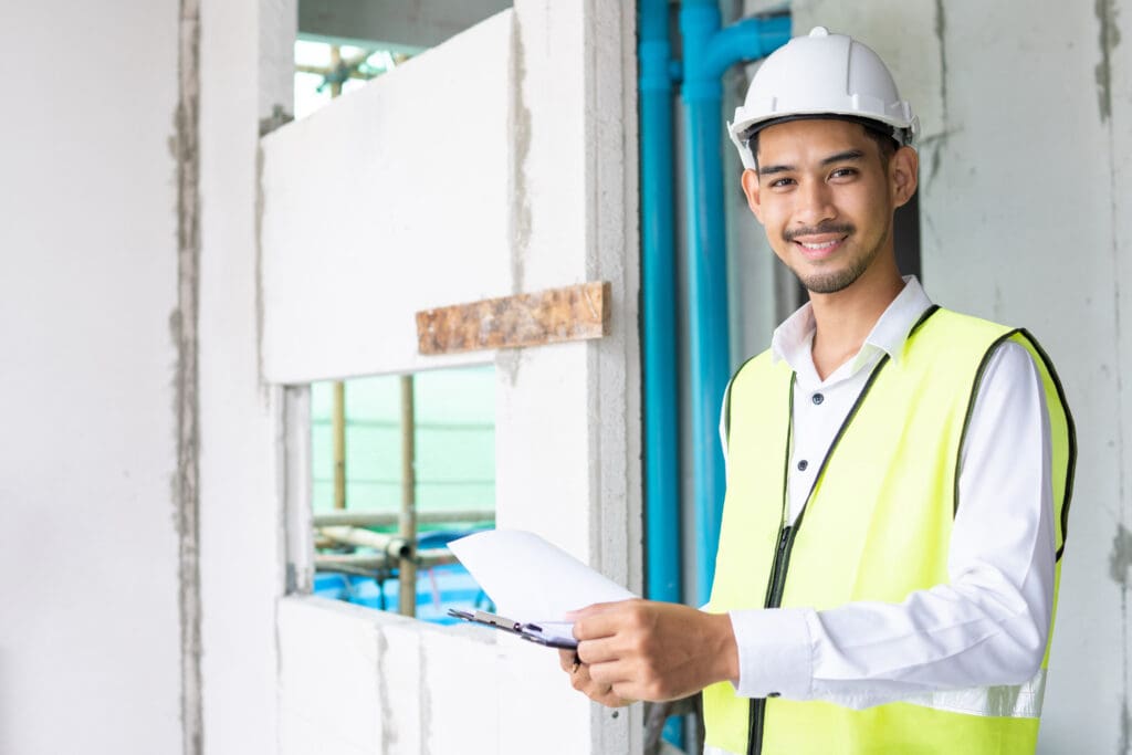 portrait of inspector holding clipboard opening paper and checking home