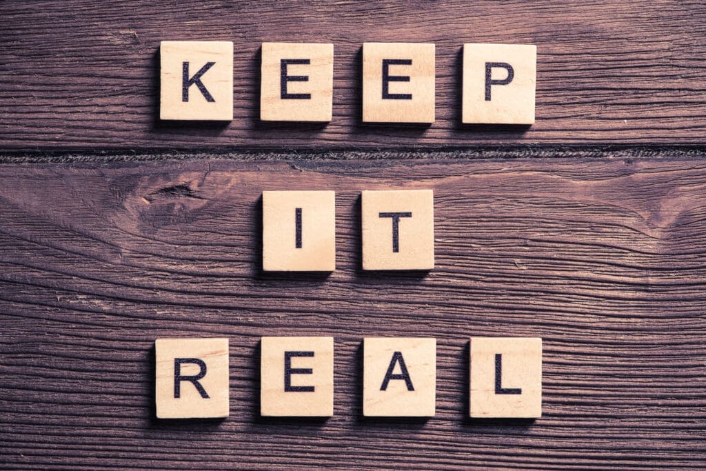 keep it real phrase collected of wooden elements with the letters