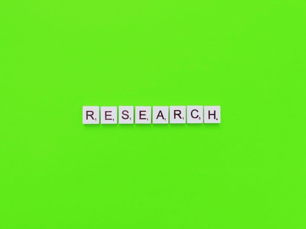 Block tiles with the word RESEARCH on a green background