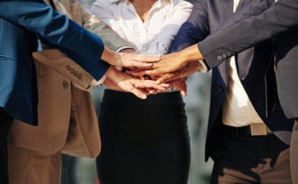 Business team stacking hands