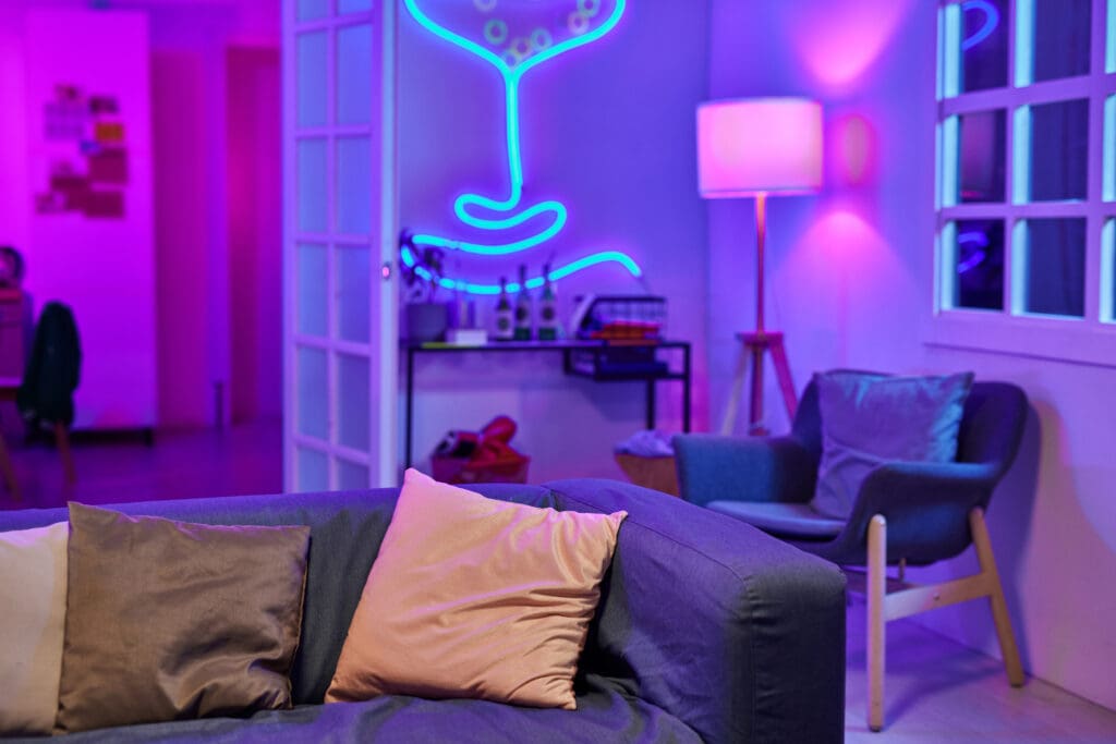 Living room with purple lights and furniture