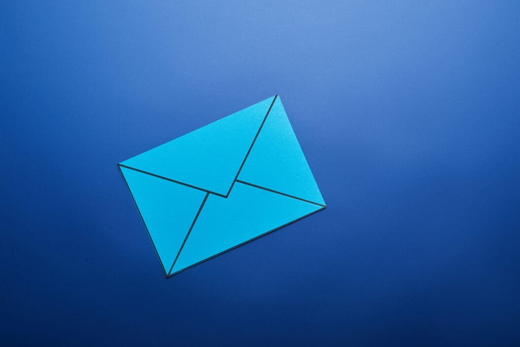 Top view of light blue email sign on blue background